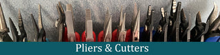 Rack of pliers and cutters for jewelry making.