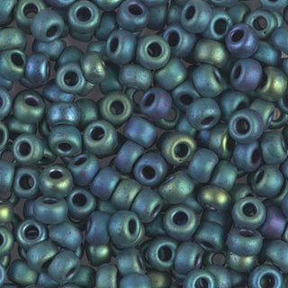 Closeup of size 6/0 matte metallic blue green iris Miyuki seed beads.