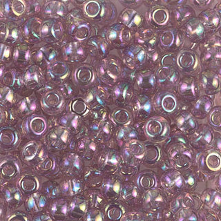 Closeup of size 6/0 transparent dark smoky amethyst AB Miyuki seed beads.