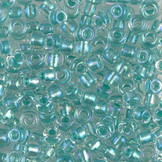 Closeup of size 6/0 sparkle aqua green lined crystal AB Miyuki seed beads.