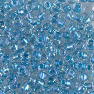 Closeup of size 6/0 sparkle sky blue lined crystal AB Miyuki seed beads.