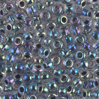 Closeup of size 6/0 noir lined crystal AB Miyuki seed beads.