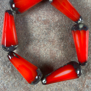 Strand of 9x20mm scarlet red Czech glass faceted drop.