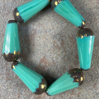 Strand of seagreen with gold Czech glass 20x9mm faceted drop.