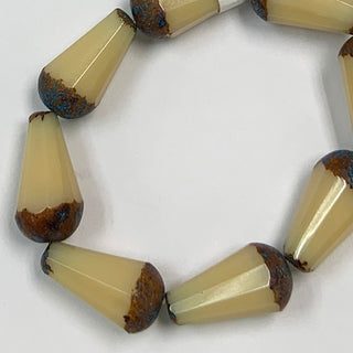 Strand of Czech Glass 15x8mm Faceted Drop Beige w/Picasso beads.