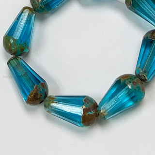 Czech Glass 8x15mm faceted drop beads strand sky blue/gold.