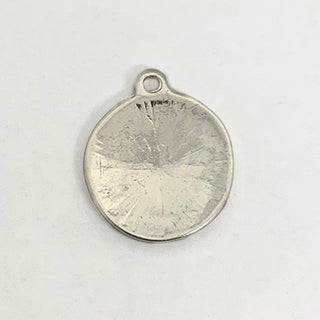 Back side of a silver plated charm with textured  surface.
