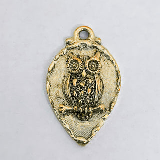 Gold plated teardrop charm with raised owl and rim.