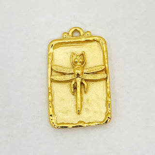 Gold plated hammered rectangular pendant with raised dragonfly and rim.