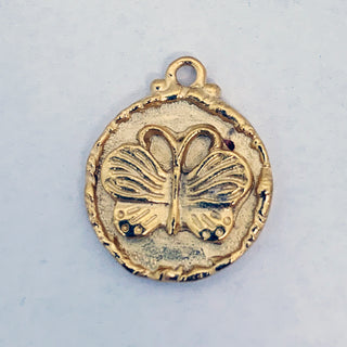 Satin Gold plated round pendant with embossed butterfly and rim.