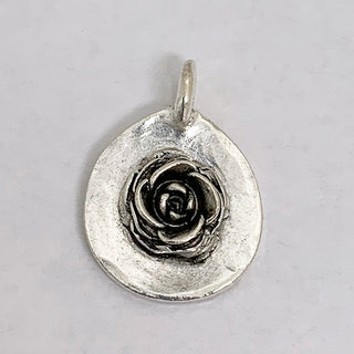 Silver plated teardrop charm with a 3D rose on it..