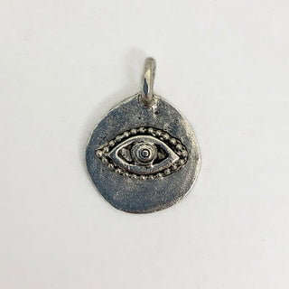 Antique silver plated charm with an embossed eye.