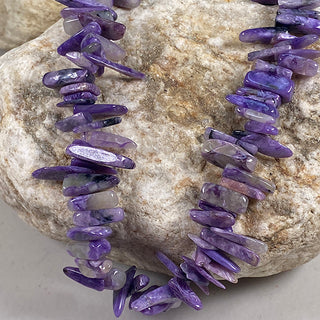 Charoite A Grade 3-5x10mm Teeth Top Drilled beads strand.