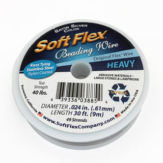 A spool of Soft Flex Beading WIre in Satin Silver, used as a stringing material for beads.
