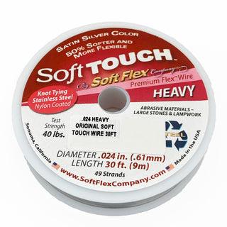 A spool of Soft Touch Beading WIre in Satin Silver, used as a stringing material for beads.