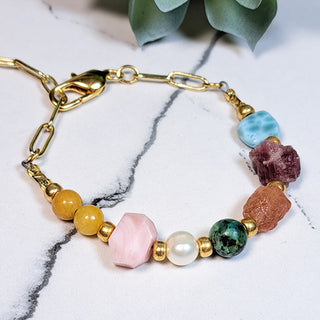 Gold and Crystal Gemstone bracelet with Paper Clip Chain and featuring premium natural Sunstone, Freshwater Pearl, Larimar, Pink Peruvian Opal, Yellow Jade, African Turquoise, & Pink Tourmaline in Quartz
