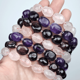 bead strands on a hand with white background