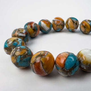 blue and orange beads on white