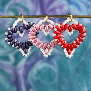 purple, pink, and red beaded heart pendants