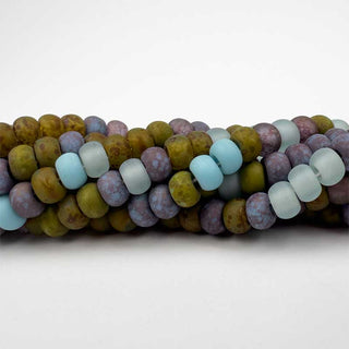 Multicolored Czech Glass Beads with large-holes on a white background