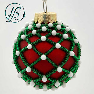 Beaded ornament with red bulb and green and white beads.