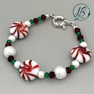 Red, White, and Green Peppermint Candy style bracelet on a grey background