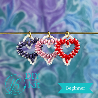 3 beaded heart pendants on a blue background