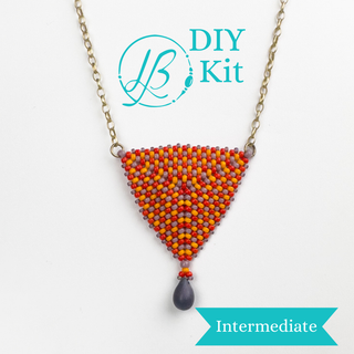 A necklace kit with a green pendant shaped like a tree