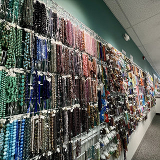 Wall of hanging bead strands.
