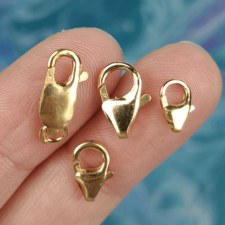 4 gold clasps on fingers
