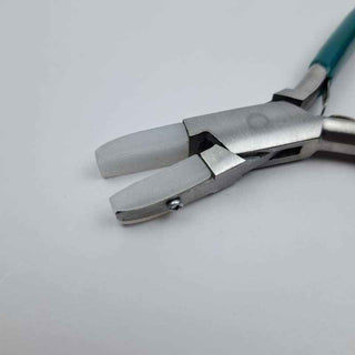 close up of Nylon jaw pliers with green handle on a  white background