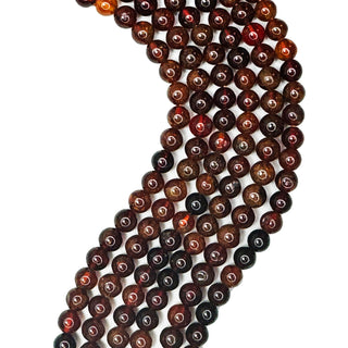 Strands of 6mm round  Hessonite Garnet.