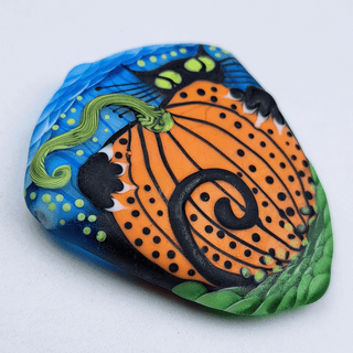 Lampwork glass bead of black cat with pumpkin
