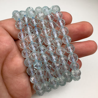 Topaz 7mm Round Faceted 15.5in Strand in hand