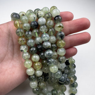 Prehnite 10mm Round 15.5in Strand in hand
