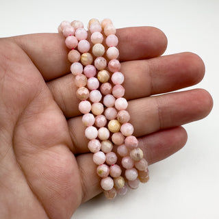 Peruvian Pink Opal 5mm Round in hand