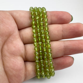 AAA+ Peridot 4mm Round Faceted 15.5in Strand
