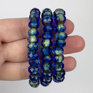 6x9mm Large Hole Roller Bead Gold Lined Cobalt 25 Bead Strand