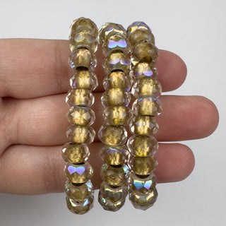 6x9mm Large Hole Roller Bead Gold Lined Transparent AB 25 Bead Strand