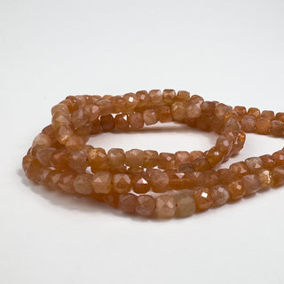 Sunstone 4mm Faceted Cube 15.5in Strand