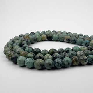 African Turquoise 6.5mm Round Large Hole 7.5in Strand