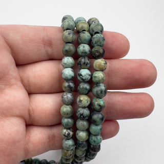 African Turquoise 6.5mm Round Large Hole 7.5in Strand