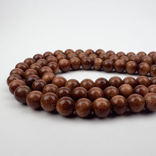 Goldstone 8mm Round Large Hole 7.5in Strand