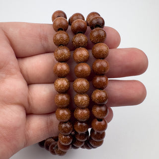 Goldstone 8mm Round Large Hole 7.5in Strand