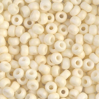Closeup of size 6/0 matte opaque cream Miyuki seed beads.