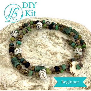 Beaded Bracelet Kit in green and brown tones on rock with a white background