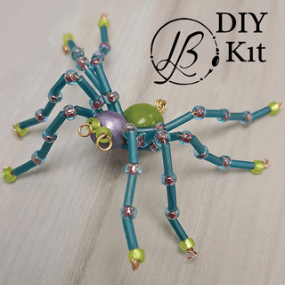 green, purple, and blue beaded spider 