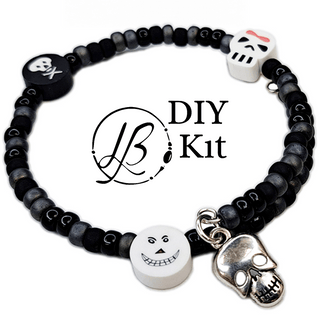 black bracelet with charms on white background