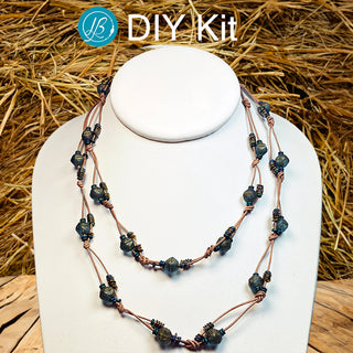 DIY Cover of necklace kit with teal beads and tan leather cord.