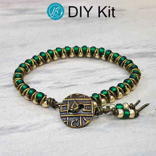 DIY emerald and silver beads in a leather cord bracelet.